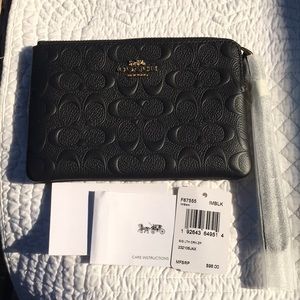 NWT Coach Wristlet in signature black leather. Perfect for formal & casual use